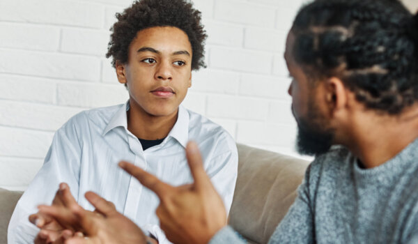 father son family man child conversation talking parent boy discussion communication together male togetherness bonding care lifestyle home childhood talk love dad